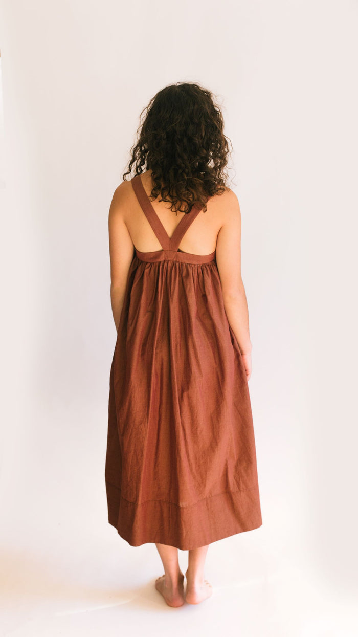 Back view of Jumper. Model stands in front of white backdrop.