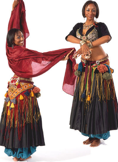 Photo of front and back views of woman in full tribal belly dance outfit. In back view woman is holding a scarf in arms and looks back over her shoulder towards the camera. The front view shows her standing with arms crossed in front of her holding cymbals.