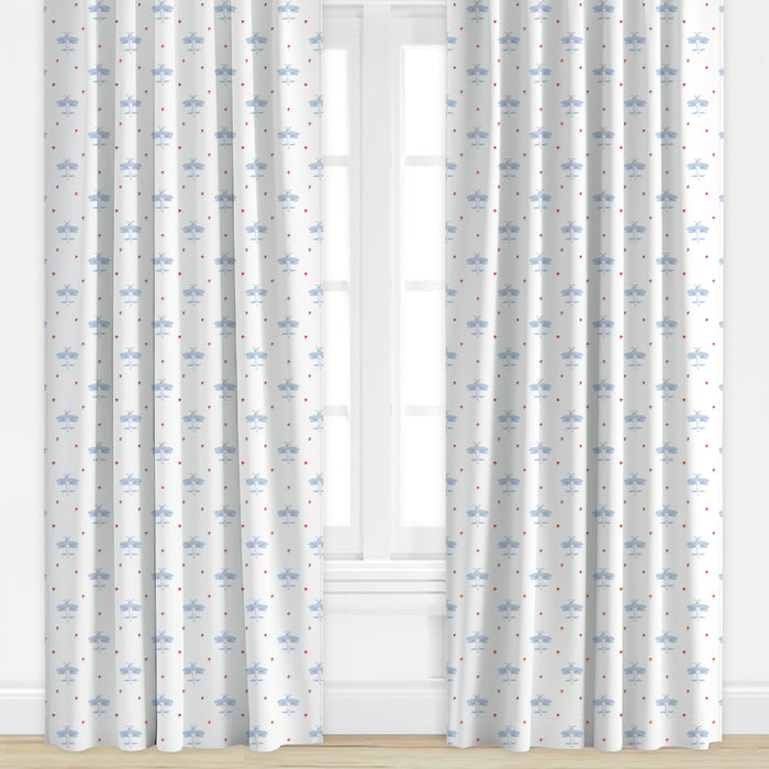 Airplane patterned drapes in blue and red by Camilla Moss