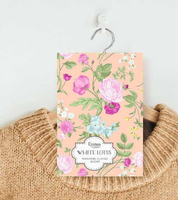 Eternia® white lotus floral fragrance sachet with hanging loop and label