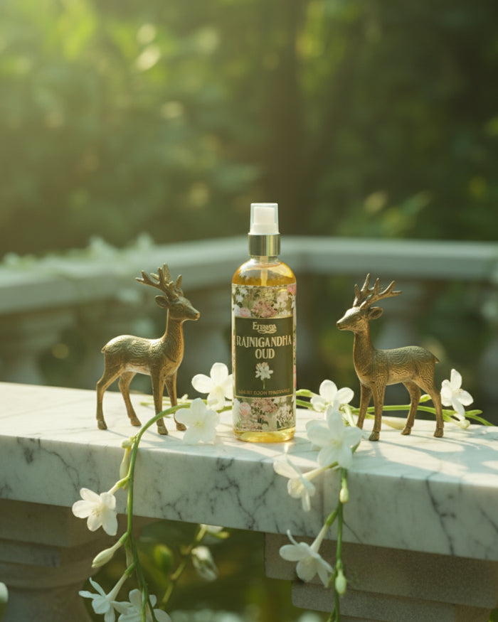 Room spray bottle with amber liquid, white pump, green label with floral wreath