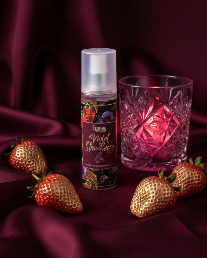 Room spray bottle with white cap, Violet Strawberry label beside faceted glass
