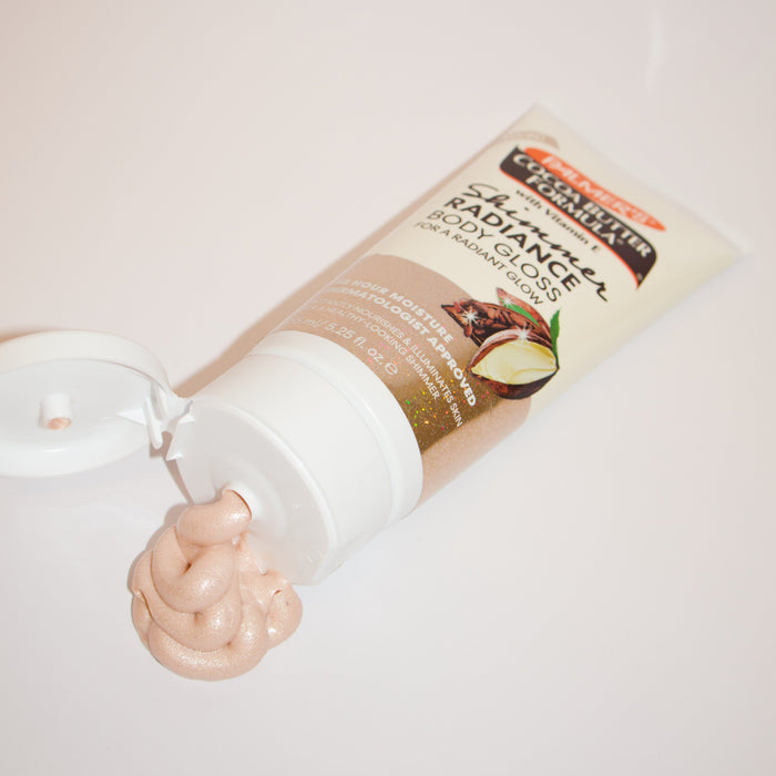 Tube of Palmer's Shimmer Radiance body gloss with a swatch on a white background