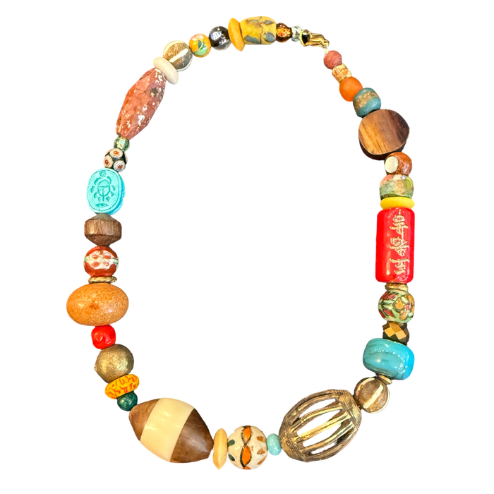 one of one necklace, statement bead necklace, collected bead necklace, artisan necklace, spice market necklace, earthy jewelry, maximalist necklace, wood bead necklace, turquoise statement necklace, boho luxury jewelry, wearable art necklace, eclectic accessories, resort jewelry, boutique jewelry, colorful statement necklace, travel inspired jewelry, chunky bead necklace, globally inspired jewelry, curated accessories, unique artisan necklace