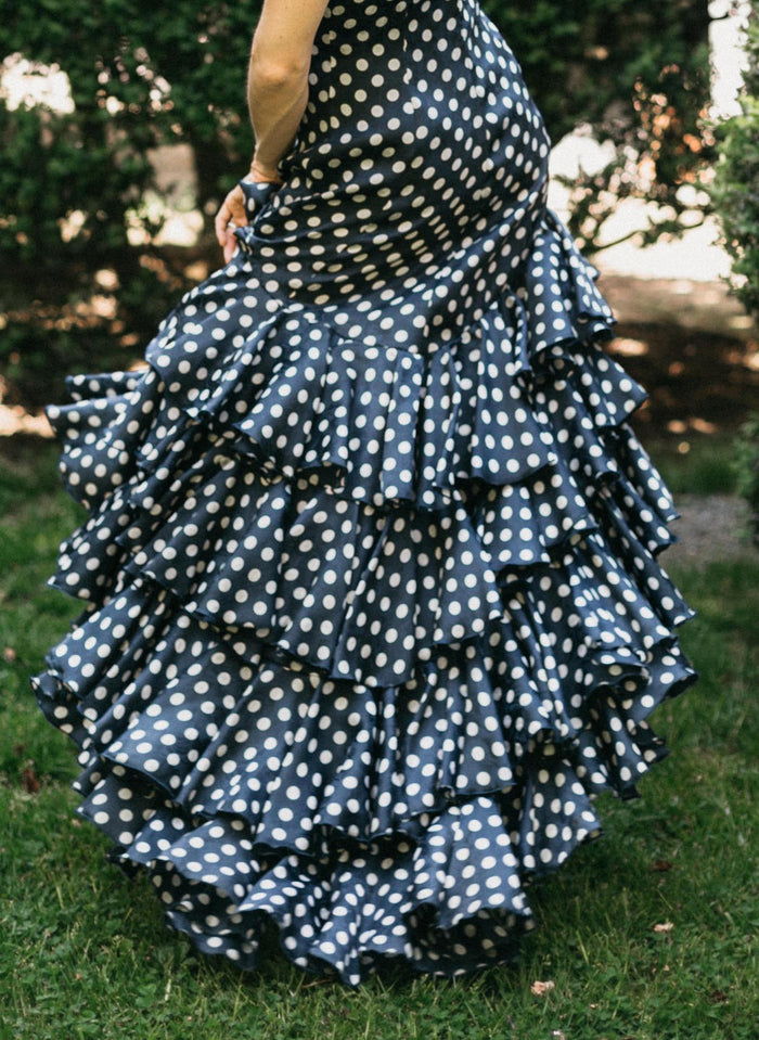 CLose up photo of the Flamenco dress skirt in motion.  view is from back and shows the many layers of ruffles.