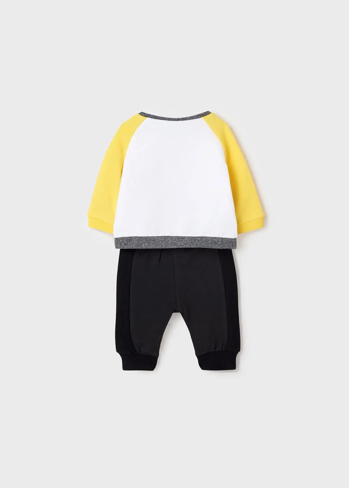 Full view: raglan tee with black joggers, elastic waist.