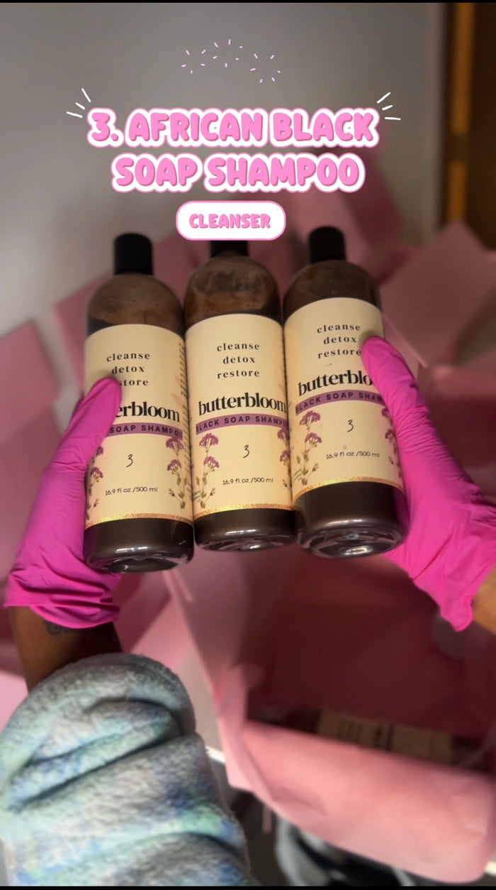 Bottle of Butterbloom African Black Soap Shampoo for hair growth, showing the product label and packaging.