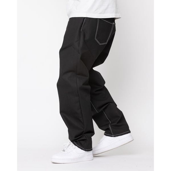 Model wearing BLKWD Relaxed XL - Felix Raw Denim jeans styled with a white t-shirt and sneakers for a casual, laid-back look