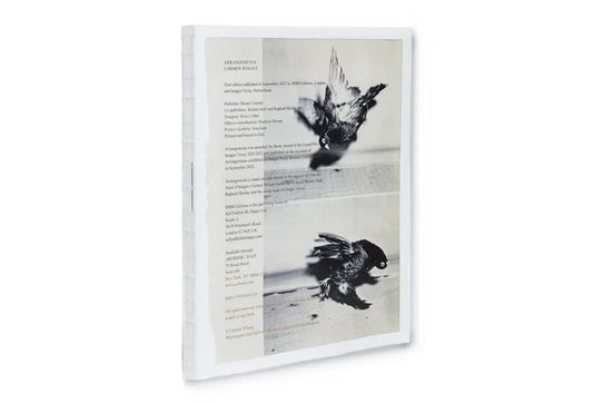 image of book that shows two black and white images of pigeons and text across it