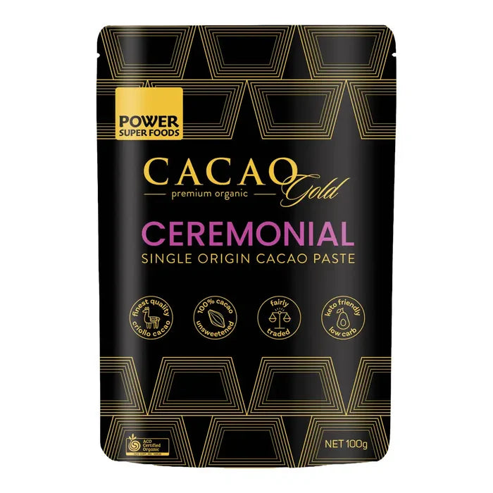 Cacao Gold Ceremonial packaging with gold and purple text on a black background