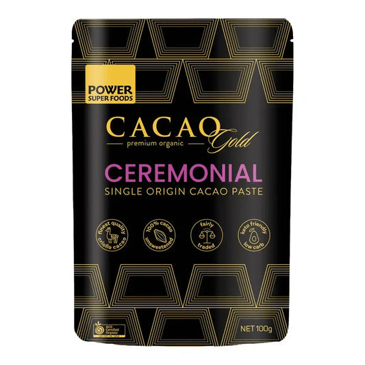 Cacao Gold Ceremonial packaging with gold and purple text on a black background
