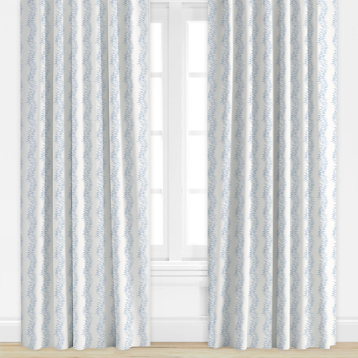 Blue patterned drapes by Camilla Moss