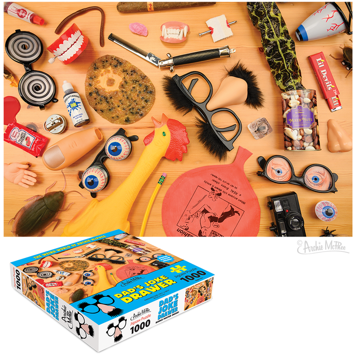 A selection of humorous gifts, including a rubber chicken, fake nose, joke glasses, and practical joke supplies, is displayed next to the challenging Dad's Joke Drawer Puzzle.
