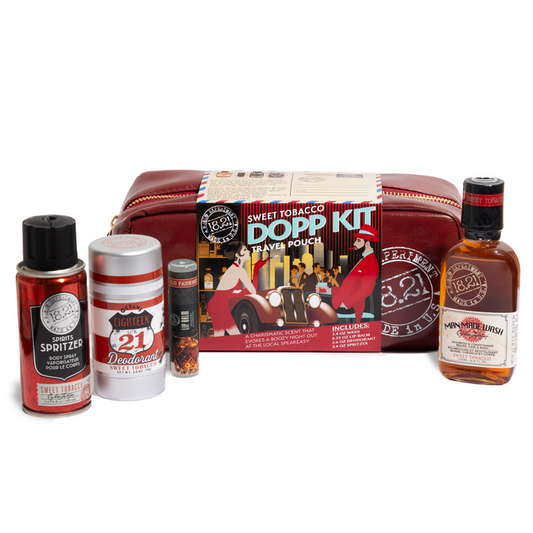 Collection of men's grooming products including a DOPP kit, deodorant, lip balm, travel size wash and cologne on a white background.