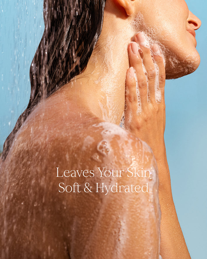 Person washing their face with water, with text 'Leaves Your Skin Soft & Hydrated' on a blue background