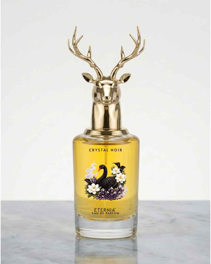 Eternia Crystal Noir eau de parfum bottle with gold deer antler cap