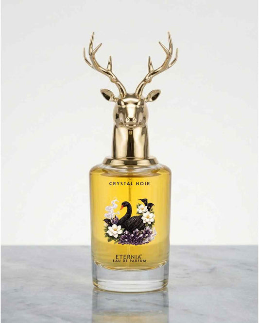 Eternia Crystal Noir eau de parfum bottle with gold deer antler cap