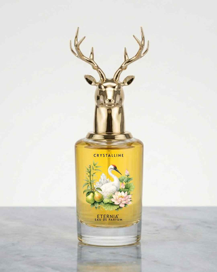 Eternia Crystalline eau de parfum bottle with gold deer cap and amber liquid