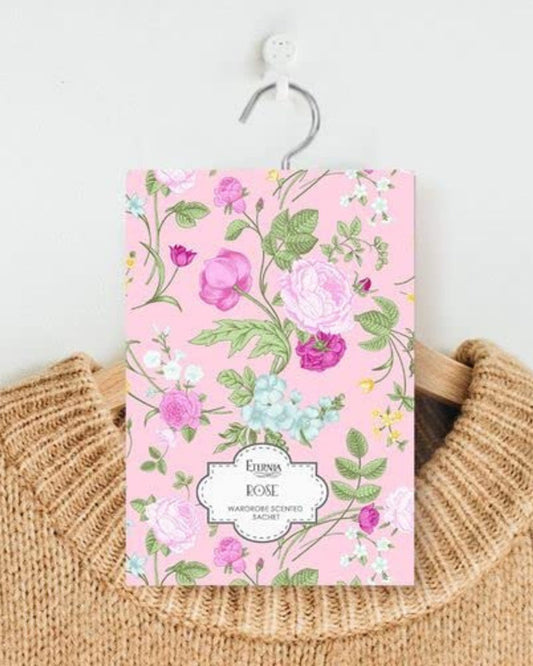 Rose-scented wardrobe fragrance sachet with pink floral pattern and hanging string