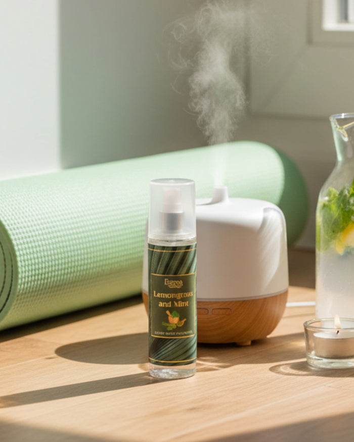 Luxury room spray bottle with white cap and green label, standing on a wooden table