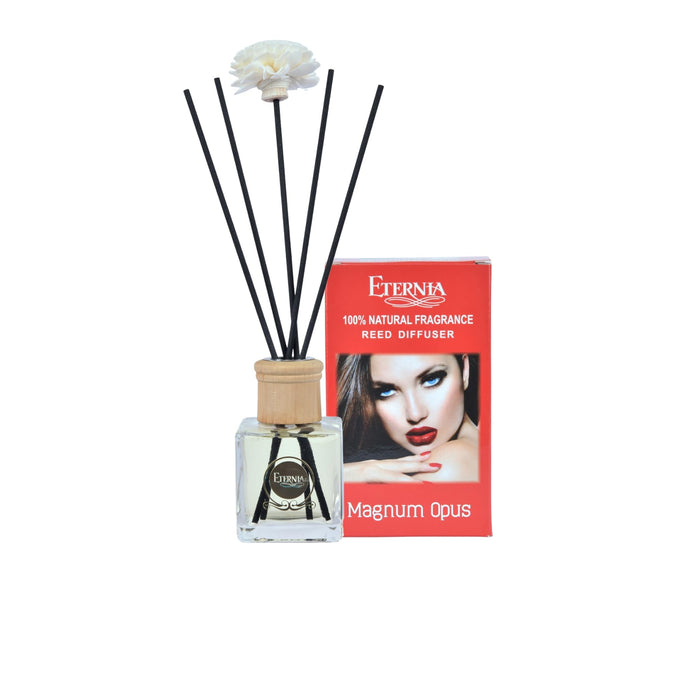 Reed diffuser bottle with rattan cap and black reed sticks in clear glass