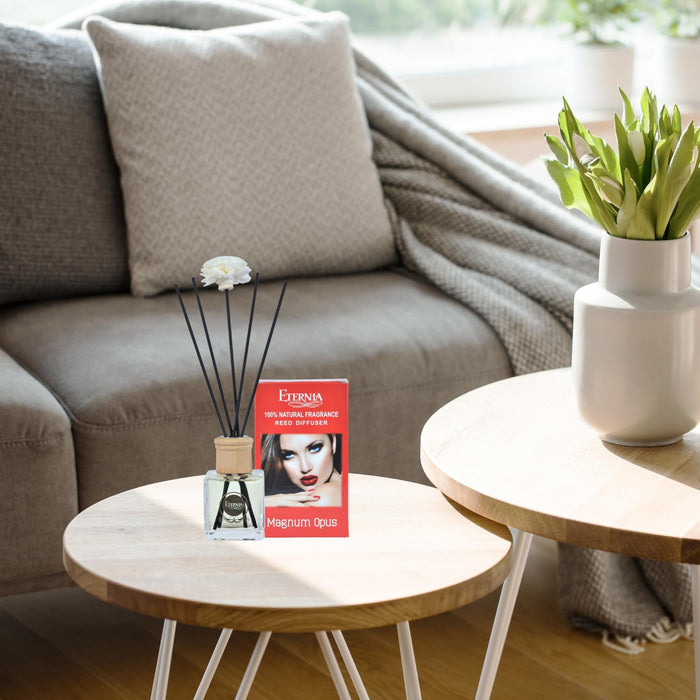 Reed diffuser set with rattan-capped bottle, black reed sticks, and boxed package