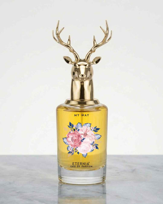 Eternia® My Way eau de parfum bottle with gold deer-antler cap and floral label