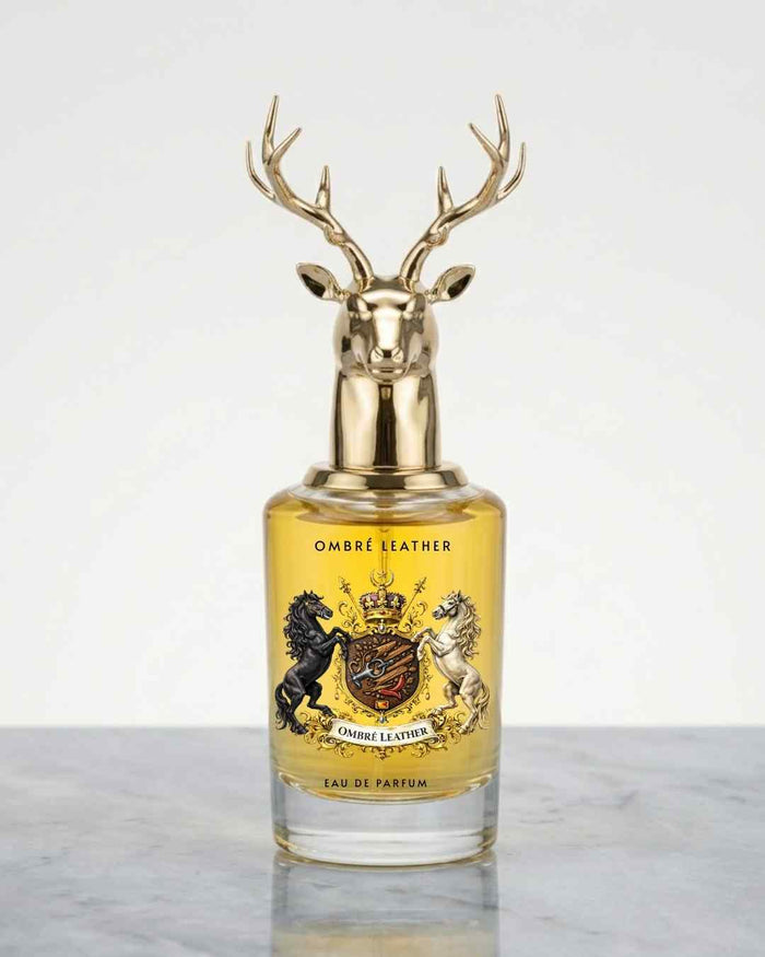 Eau de parfum bottle with gold deer antler cap and amber glass