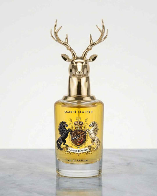 Eau de parfum bottle with gold deer antler cap and amber glass