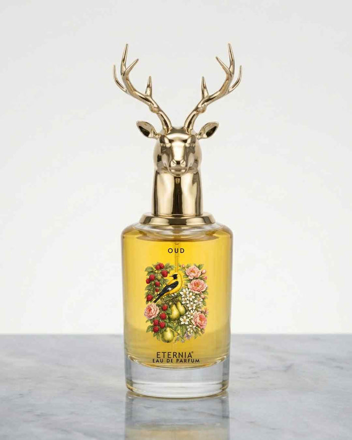 Eternia® oud eau de parfum bottle with gold deer-antler cap and glass body