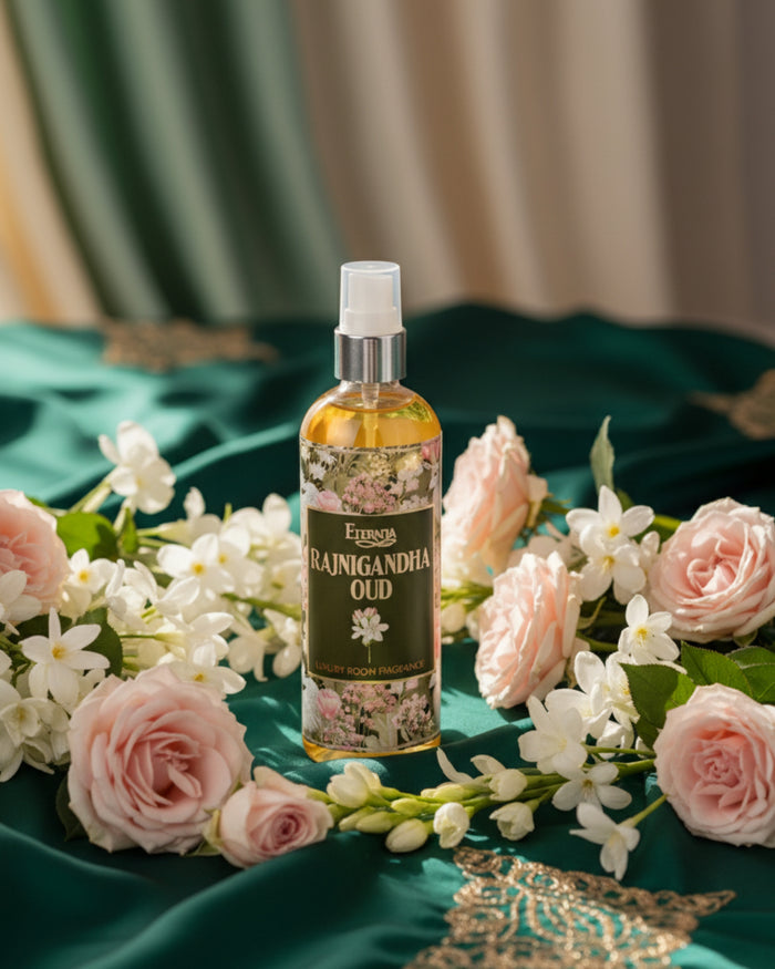 Floral room spray bottle with amber liquid, white pump, green label and dark-toned text