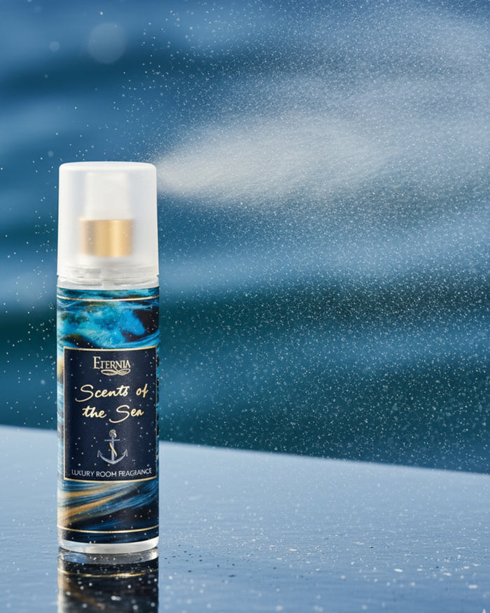Luxury room spray bottle with white cap and blue wave label, standing upright.