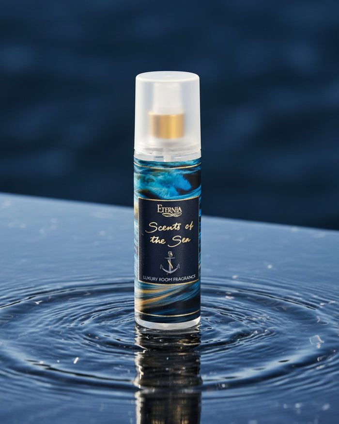 Luxury room spray bottle with white cap and blue wave label, with water splash.