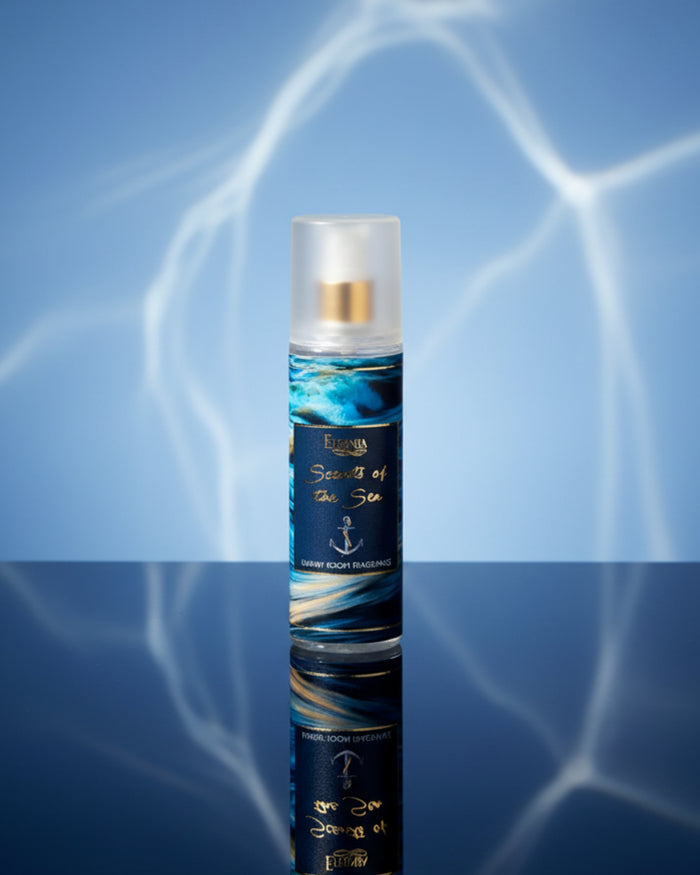 Luxury room spray bottle with white cap and blue wave label, centered view.
