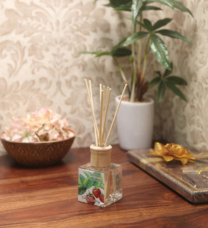 Reed diffuser bottle with clear liquid and light wood cap, rattan sticks