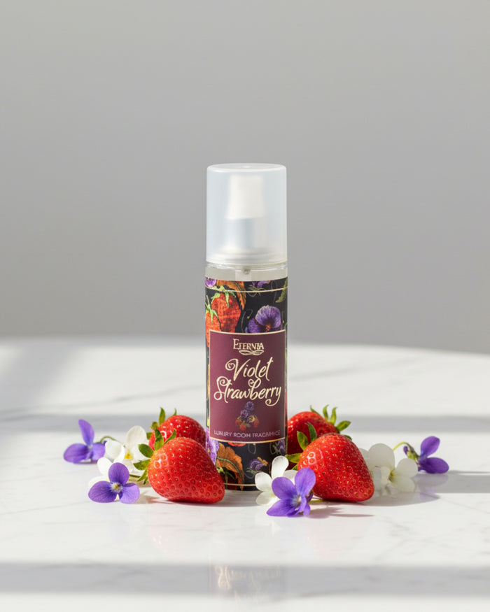 Room spray bottle on tabletop, white cap, Violet Strawberry floral label