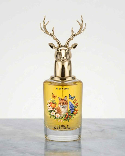 Eternia Weekend eau de parfum bottle with gold deer antler cap and yellow glass
