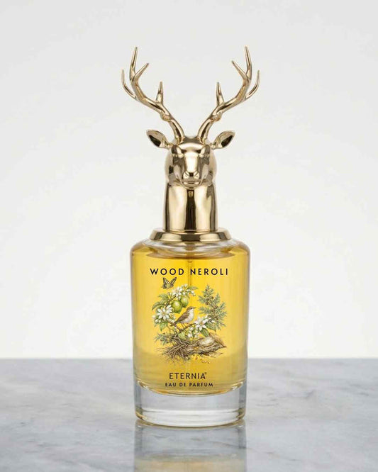 Eternia Wood Neroli Eau de Parfum bottle with deer head cap