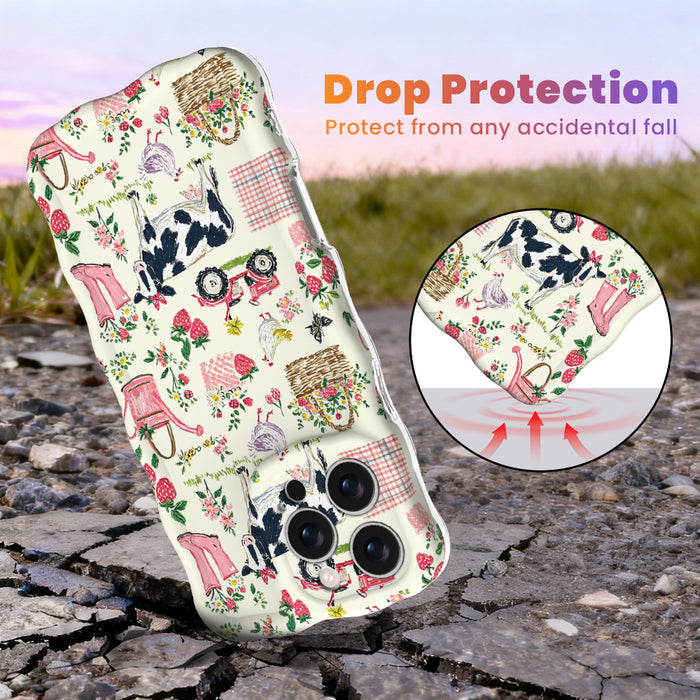 Trendy wavy white iPhone case featuring a cottagecore farmhouse pattern of cows with pink bows, strawberries, red tractors, and watering cans with a high-gloss finish.