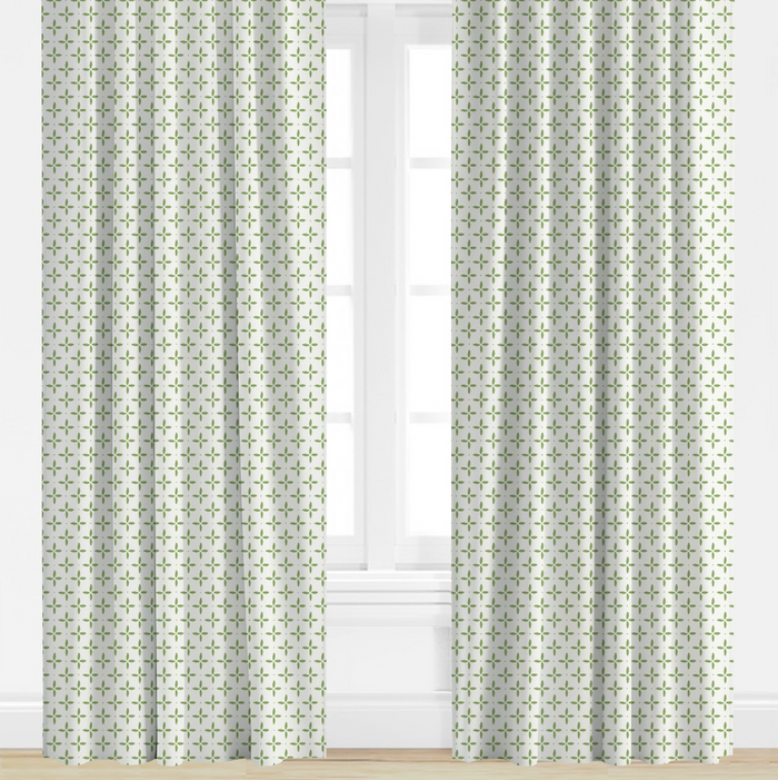 green, star Patterned curtains on a window with a light background
