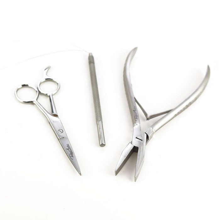 The Perfect Locks Hair Extension Tool Kit includes three stainless steel tools: scissors, a textured handle tool, and pliers.