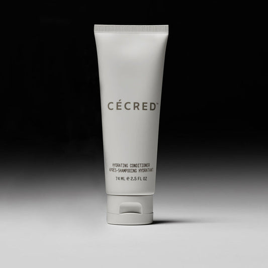 Cécred Hydrating Conditioner travel size 74ml tube displayed upright against a gradient grey background