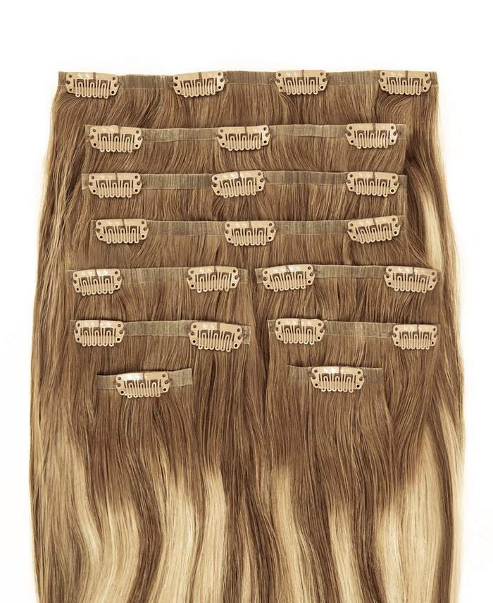 invisible clip-in hair extensions rooted beige highlights.