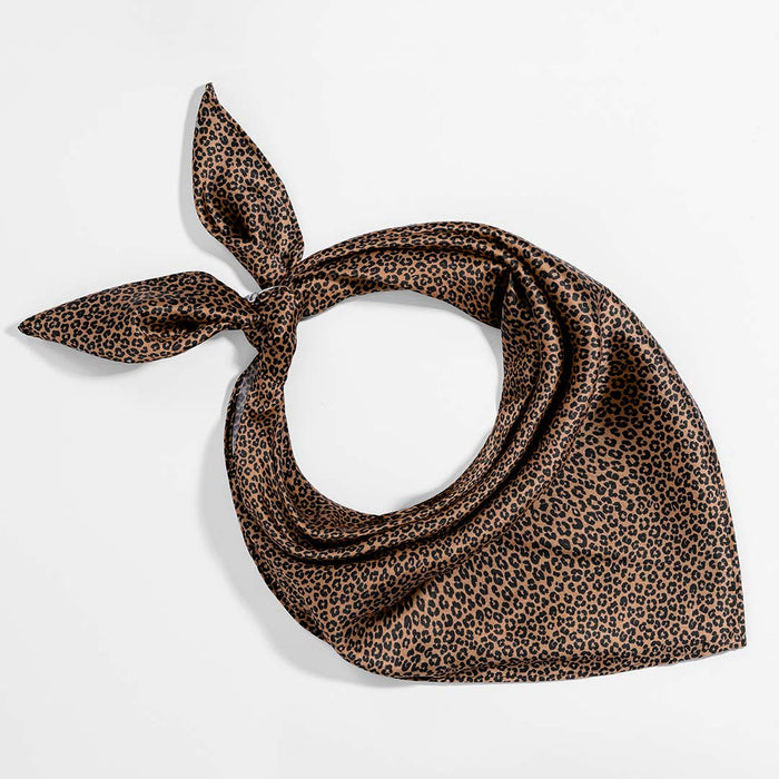 Safari-inspired satin hair accessories paired with a lightweight crochet summer cap.