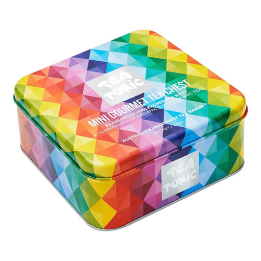 A square metal tea tin with a colorful geometric diamond pattern in rainbow colors, featuring the 'Tea Tonic' brand logo on the lid and side.