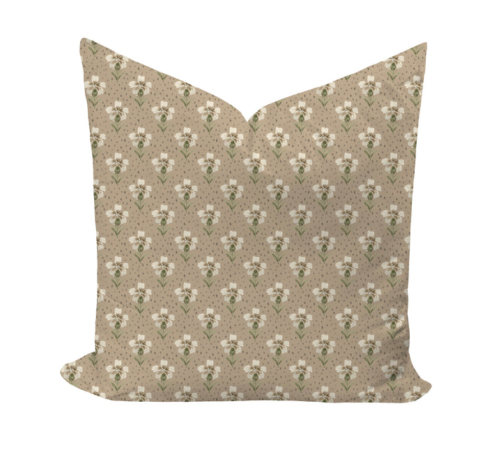 Floral patterned pillow on a beige background by Camilla Moss