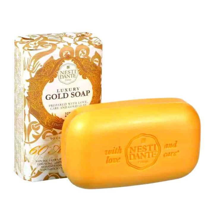Gold bar soap with logo; wrapper in background