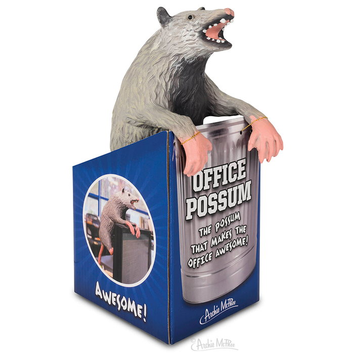 The Office Possum, crafted from stuffed latex, emerges from a beautifully illustrated blue box bearing its name. With the accompanying text, "The possum that makes the office awesome!" and posable paws for added playfulness, it promises to infuse any workspace with a delightful sense of fun.