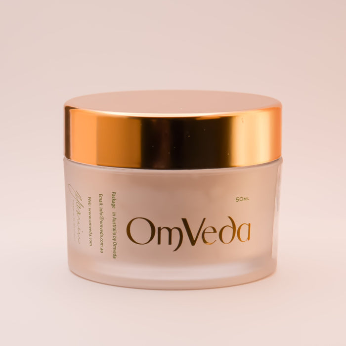 OmVeda exfoliating grains jar with gold lid, translucent cream body, 50 ml