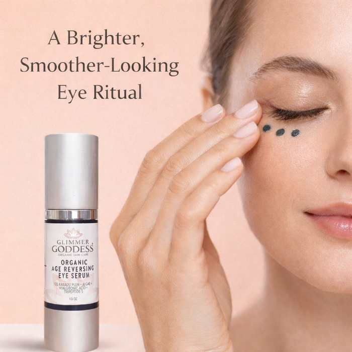 Glimmer Goddess Organic Age Reversing Eye Serum for eyes with a sleek bottle and applicator in a natural skincare setting